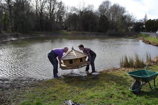 Moving duckhouse in position